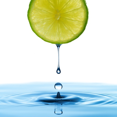 Water drop from lemon sliceの写真素材