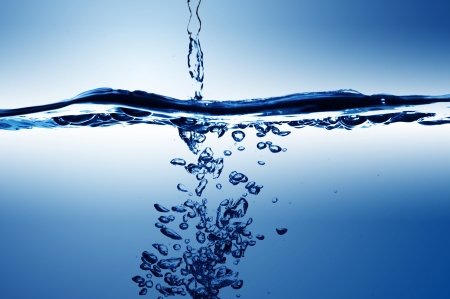Water wave and water bubble on blue backgroundの写真素材