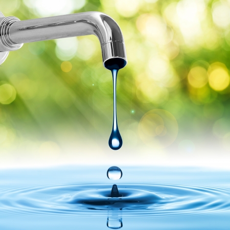Water drop from water tapの写真素材