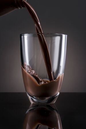 Chocolate Milk Pour into glassの写真素材