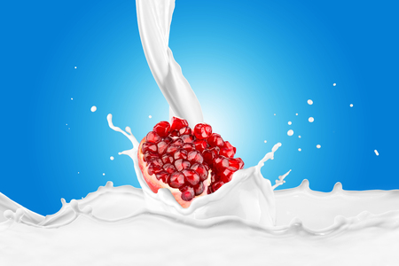 Fresh Pomegranate With Milk Splashの写真素材