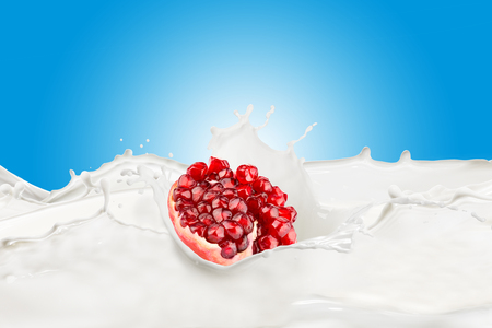 Fresh Pomegranate With Milk Splashの写真素材