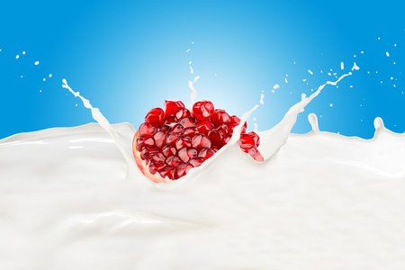 Fresh Pomegranate With Milk Splashの写真素材