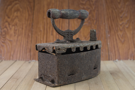 Old irons with rusty on wood backgroundの写真素材