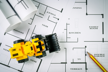 Top view of architect drawing on non identified architectural project with various of tools such as...
