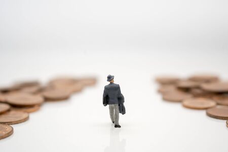 Miniature toy: Business man walking to business road , business ,financial, Success, Business Growth concept.の写真素材