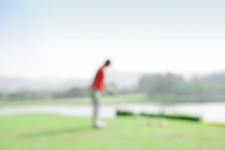 Blur photography golf player during hit golf ball at beautiful tropical golf course .Healthy exercise golf game concept.の写真素材