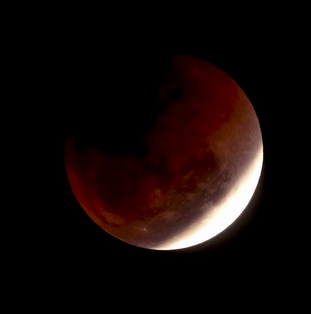 Blur photography, Red lunar eclipse or full moon on black background.                          の写真素材