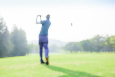 blur photograpy golf player during hit golf ball at beautifull tropical golf course .Healthy exercise golf game concept.の写真素材
