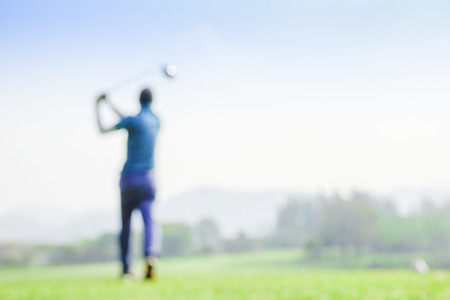 blur photograpy golf player during hit golf ball at beautifull tropical golf course .Healthy exercise golf game concept.の写真素材