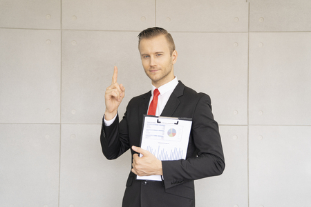 business man show good progress of work in office.の写真素材