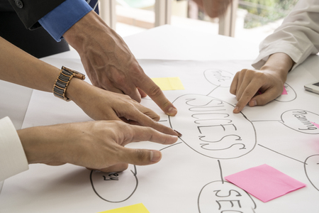 Entrepreneurs and business people conference in modern meeting room,point to target of team ,business concept.の写真素材