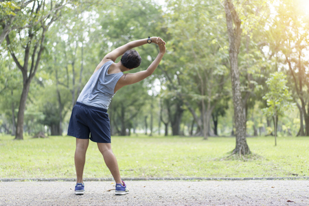 Sporty man jogging or exercise in national park on early morning .Sport concept.の写真素材