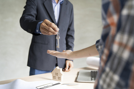 Civil engineer or architect hand over home to owner on working site ,Architect concept.の写真素材