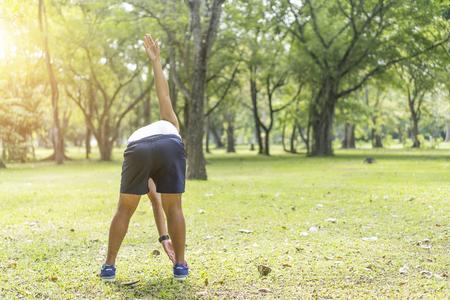 Sporty man jogging or exercise in national park on early morning .Sport concept.の写真素材
