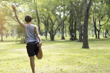 Sporty man jogging or exercise in national park on early morning .Sport concept.の写真素材