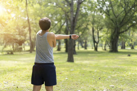 Sporty man jogging or exercise in national park on early morning .Sport concept.の写真素材