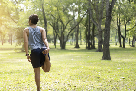 Sporty man jogging or exercise in national park on early morning .Sport concept.の写真素材