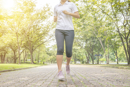 Sporty man jogging or exercise in national park on early morning .Sport concept.の写真素材