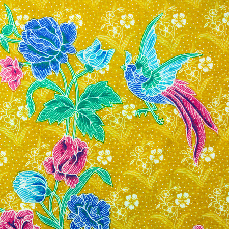 Closeup of retro tapestry fabric pattern with classical image of the colorful flowers and birds on...