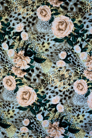 texture of print fabric striped leopard and flower for backgroundの写真素材
