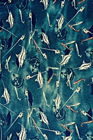 texture fabric with marine fish fishing rod and reel for backgroundの写真素材
