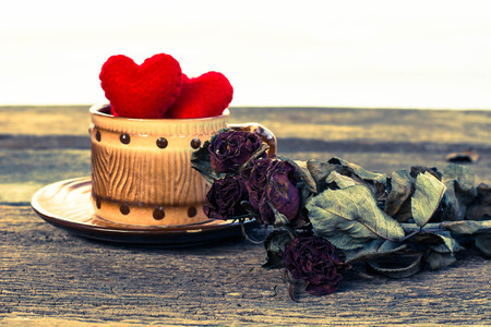 Red heart on a glass coffee set on old woodenの写真素材