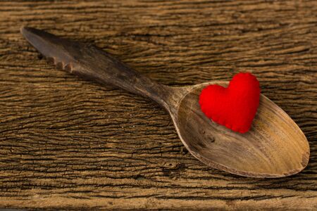 red hearts in wooden spoonの写真素材