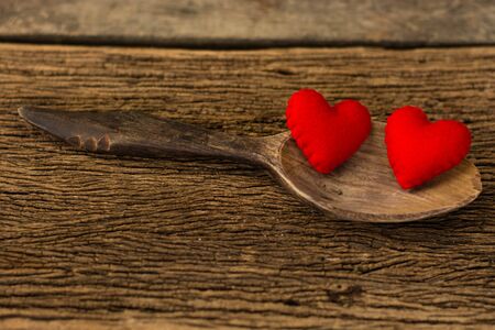 red hearts in wooden spoonの写真素材