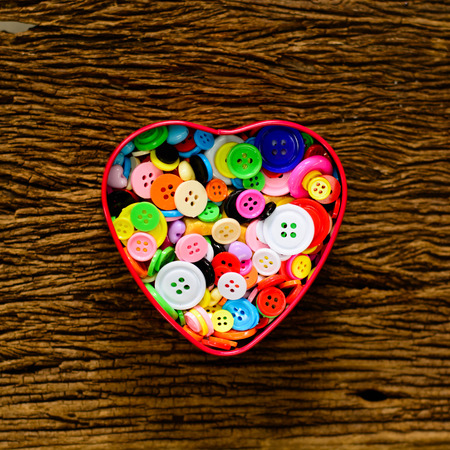 Many Buttons in the shape of a heart steel