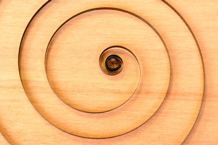 Circle of steel on the wooden floorの写真素材