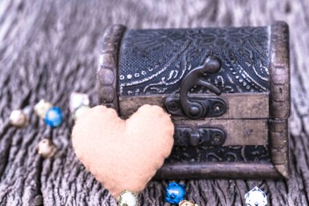 Ancient treasury chest full of red heartsの写真素材