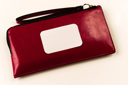 Woman pink handbag lay on the old wooden floor white background