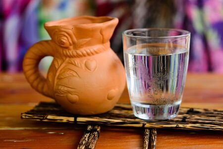 closeup Glass of water on table in the living room , vintage and retro styleの写真素材