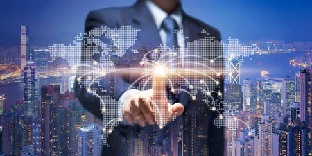 Business Man touch on world map. Businessman point at earth connection line show business building,...