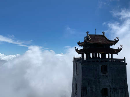 Silhouette of the tower of the pagoda in the cloudsの写真素材