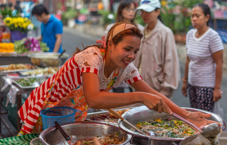 Bangkok, Thailand - January 25, 2015 Unidentified woman is selling foods on street in the morning at Houay Kwang area.のeditorial素材