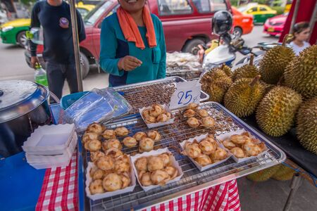 Bangkok Thailand  May 23 2015 Ka Nom Kok dessert that making from coconut milk for sell on street at Jatujak market the biggest weekend market in South East Asia. Visit by taking MRT to Kampengpet stationのeditorial素材