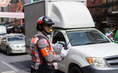 Bangkok, Thailand - July 15, 2015 Unidentified traffic police man is working on street of Yaowarat...