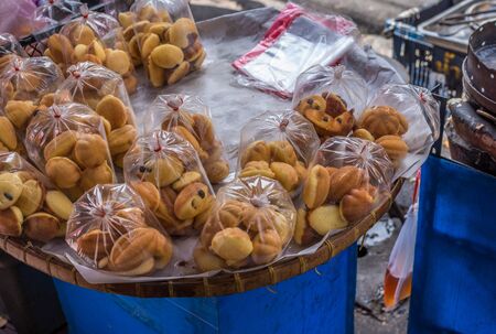 Thai Style Cake for sell in plastic bag on a sidewalk of Bangkok.の写真素材