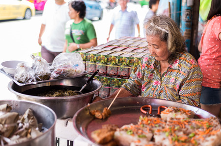 Bangkok, Thailand - July 15, 2015 Unidentified old woman is selling Chinese food on street of Yaowarat area  or Thailand's China Townのeditorial素材