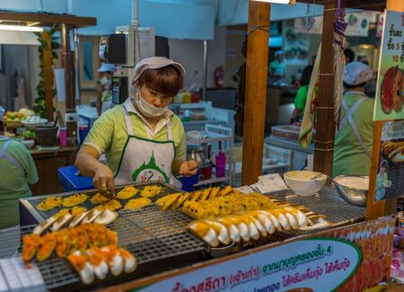 Bangkok, Thailand - Nov 14, 2015 Unidentified woman is selling Khanom bueang or Thai's crepes in food court  of JJ Mall which located next to Chatuchak market.のeditorial素材