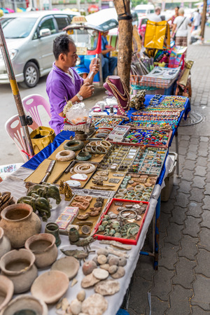 Bangkok, Thailand - Nov 14, 2015 Unidentified man is selling antique stuffs on street of Chatuchak, the biggest weekend market in South East Asia.のeditorial素材
