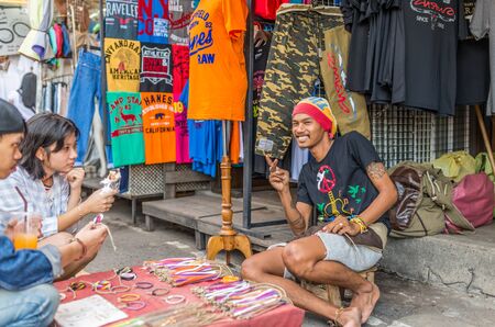 Bangkok, Thailand - Nov 14, 2015 Unidentified man is selling handmade bracelet at Chatuchak, the biggest weekend market in South East Asia.のeditorial素材