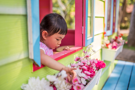 Asian toddler girl in happy time in summerの写真素材