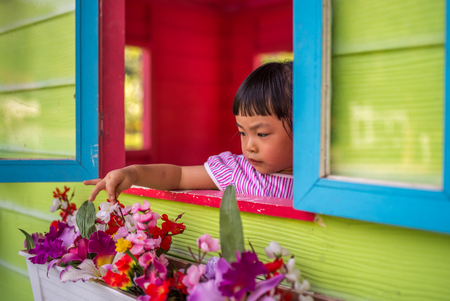 Asian toddler girl in happy time in summerの写真素材
