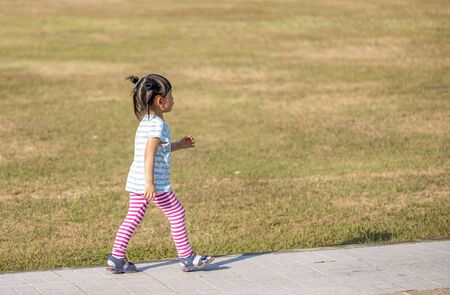 Thai little girl with 3.6 years old in a parkの写真素材