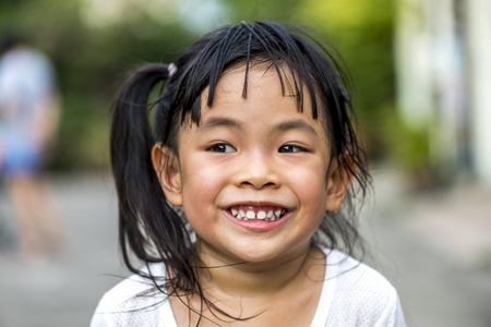 Head shot of little girl with big smileの写真素材