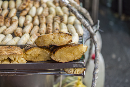 Roasted casava and banana on street food of Yaowarat, Bangkok, Thailandの写真素材