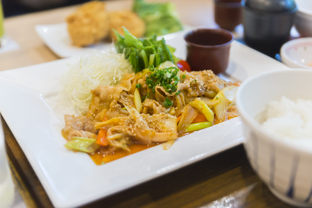 Stir fried pork with Kimchi, food set in restaurant. Food on table. Some part of image is blurred.の写真素材